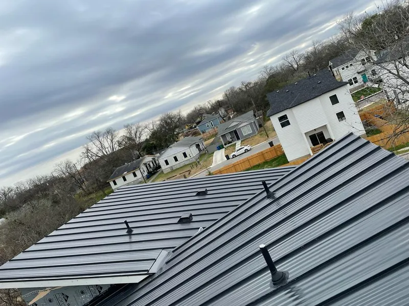 Standing seam metal roof panels with vents for Skylight Repair in Hutchins